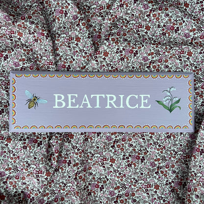 Personalised hand-painted wooden bedroom door plaque with decorative illustrations