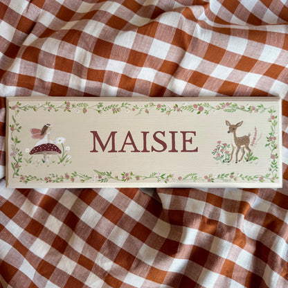 Personalised hand-painted wooden bedroom door plaque with decorative illustrations