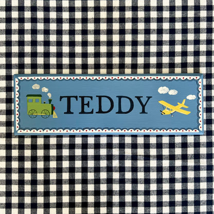 Personalised hand-painted wooden bedroom door plaque with decorative illustrations