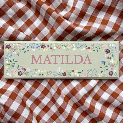 Personalised hand-painted wooden bedroom door plaque with decorative illustrations