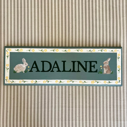 Personalised hand-painted wooden bedroom door plaque with decorative illustrations