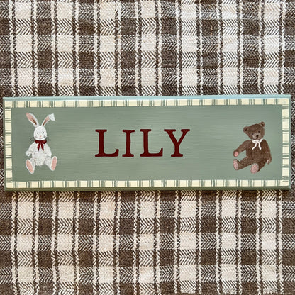 Personalised hand-painted wooden bedroom door plaque with decorative illustrations