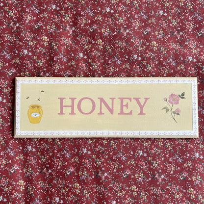 Personalised hand-painted wooden bedroom door plaque with decorative illustrations