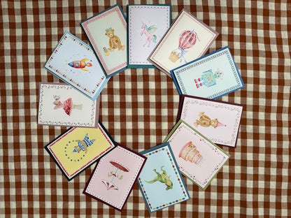 Kate MacLeod Designs greeting cards arranged in a circle